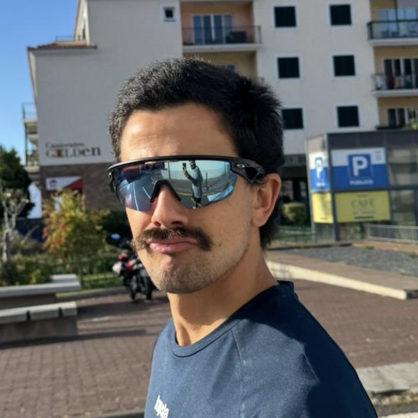 Pedro Peres, co-founder of Good Ground, wearing sports sunglasses and a moustache, outdoors in Madeira