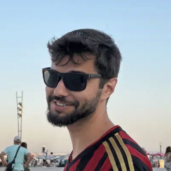 Tomás Ornelas, lead historical guide at Good Ground, smiling in sunglasses
