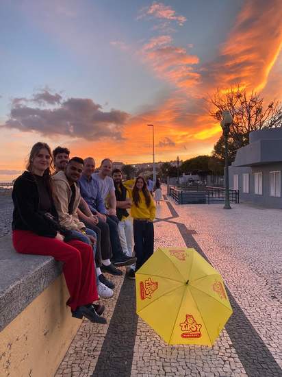 Guests watching a fiery sunset on the Funchal seafront