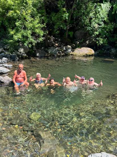 Guests swimming in a natural pool on a Madeira hike