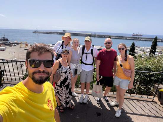 Guide taking a selfie with guests above Funchal marina